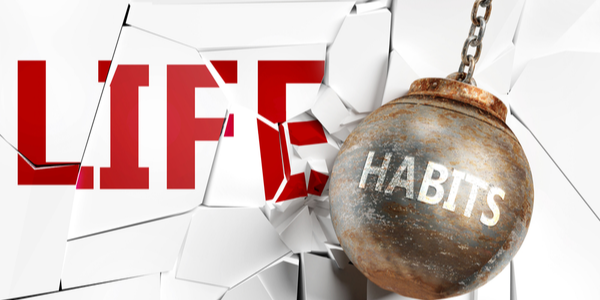 "Habits" wrecking ball hitting the word "Life"