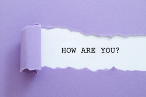 How are you? question written under torn paper.